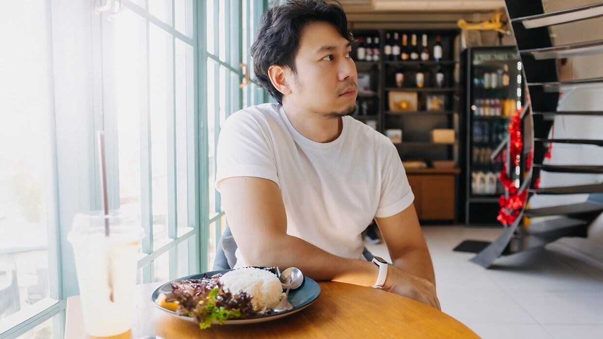A man intently observing the restaurant’s activities. A man intently observing the restaurant’s activities.